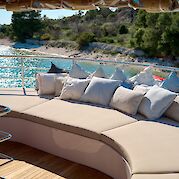 Cushioned deck lounge | Bellezza | Bike & Boat Tour