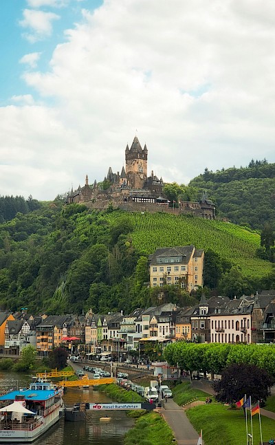 Cochem Castle perched atop a hill, Germany. Unsplash@Tharun Thejus
