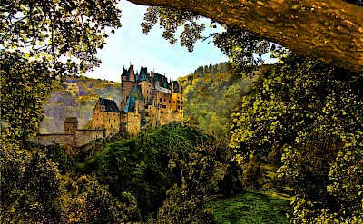 Eltz Castle seen through the trees, Treis-Karden, Germany. Unsplash@Peter Justinger