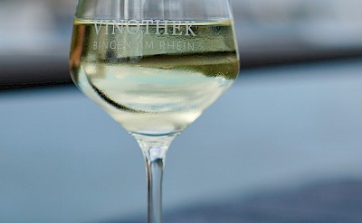 Glass of white wine in Bingen, Germany. Unsplash@Luca J