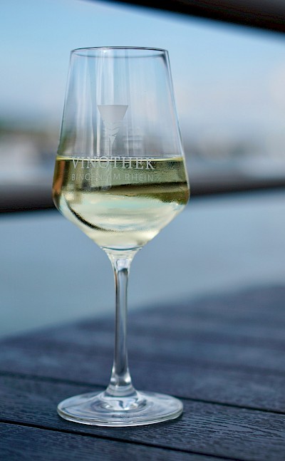 Glass of white wine in Bingen, Germany. Unsplash@Luca J