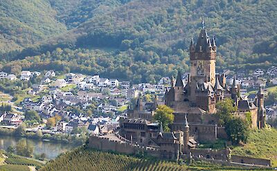 The majestic Reichsburg overlooking the Mosel River. unsplash:GruescuOvidiu