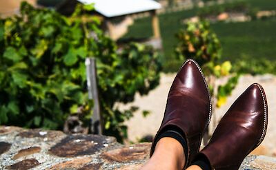 Woman resting her feet. Unsplash: Harinanda Kumar.
