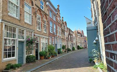 A quiet cobblestone street in historic Dordrecht. unsplash@Tjaako Minnema