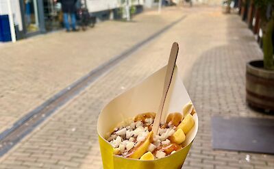 Patat oorlog, fries with mayo, satay (peanut) sauce, and onions in Holland. ©tripsite