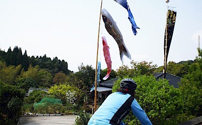 Riding past carp streamers, a symbol of Children's Day in Japan. toSR