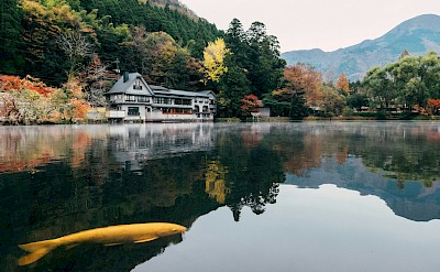 A serene mountain lake near Beppu. unsplash: Tayawee Supan