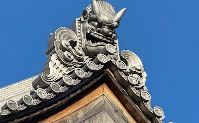 An Oni-gawara, a traditional Japanese architectural element to ward off evil spirits and misfortune. Unsplash@Radim Jaksik
