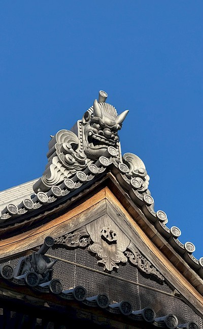 An Oni-gawara, a traditional Japanese architectural element to ward off evil spirits and misfortune. Unsplash@Radim Jaksik