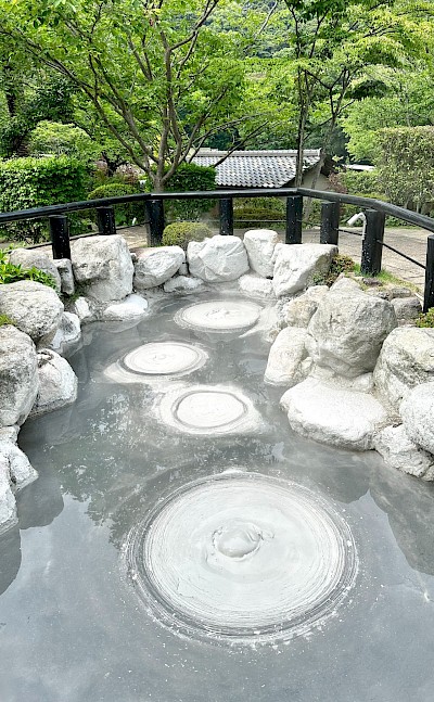 Oniishibozu Jigoku, one of Beppu’s hot springs, known for its gray mud pools that resemble the shaved heads of monks. Flickr@Bryan