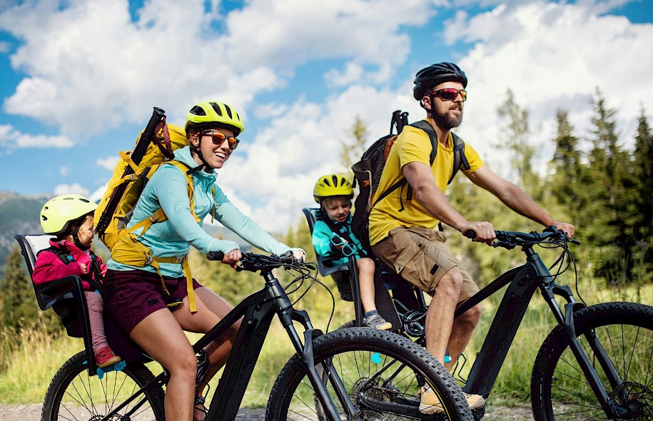 A family on a bike tour holiday. Unsplash@Getty Images