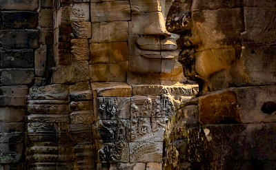 Faces in the stones, Angkor Wat, Cambodia bike tour. Unsplash@Angkor Feel