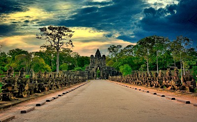Road to Angkor Wat at dusk, Cambodia bike tour. Unsplash@Allphoto Bangkok