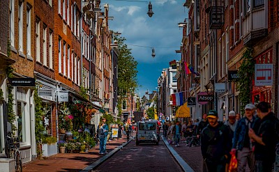 Bustling shopping street in Amsterdam. Unsplash@JahanzebAhsan