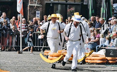 Cheese carriers at Alkmaar’s famous traditional cheese market. Pexels@KMckernek