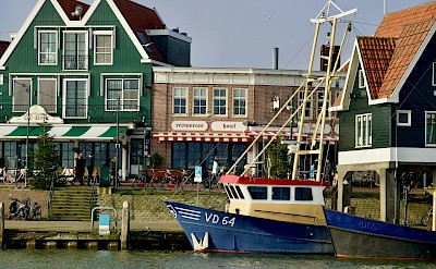 Volendam’s traditional harborfront. Unsplash@VitaliiKyktov