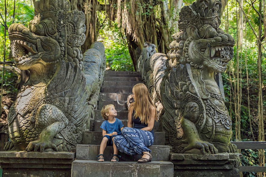 A brother and sister sitting on the steps on an ancient temple. Unsplash@Getty Images