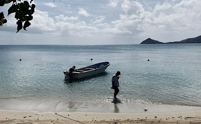 A quiet Fijian beach beside a traditional fishing boat. &copy;Mikky
