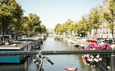 Bicycle on a bridge in Amsterdam, Netherlands. Unsplash@Carina Baumgartner