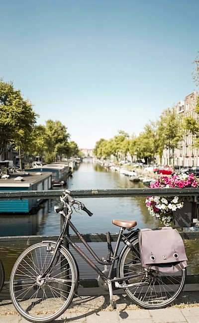 Bicycle on a bridge in Amsterdam, Netherlands. Unsplash@Carina Baumgartner