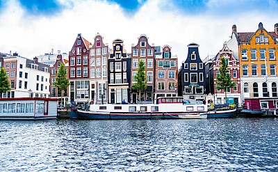 Blue skies above buildings in Amsterdam, Netherlands. Unsplash@Tobias Kordt