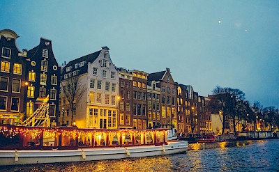 Illuminated buildings, Amsterdam, Netherlands. Unsplash@Savio Felix