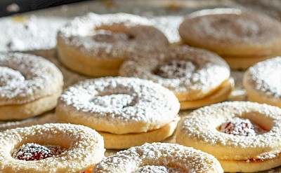 Plätzchen cookies, powdered sugar cookies filled with jam, typical of German bakeries. pexels@FrankiFrank