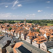 Bamberg to Regensburg - Red rooftops, church towers, and tree-lined streets in the heart of Franconia. unsplash@tourist information