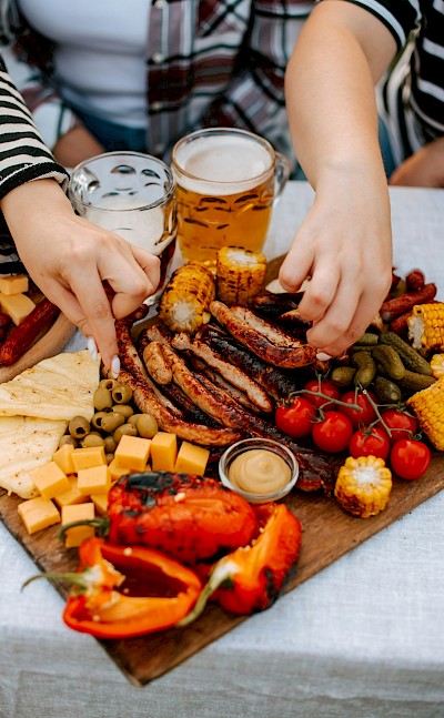 Biergarten-style meal. Unsplash@AaterynaHliznitsova