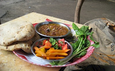 Typical ful medames in Cairo of stewed fava beans, pickled vegetables, & fresh bread. cc@Zachbe-wikimedia