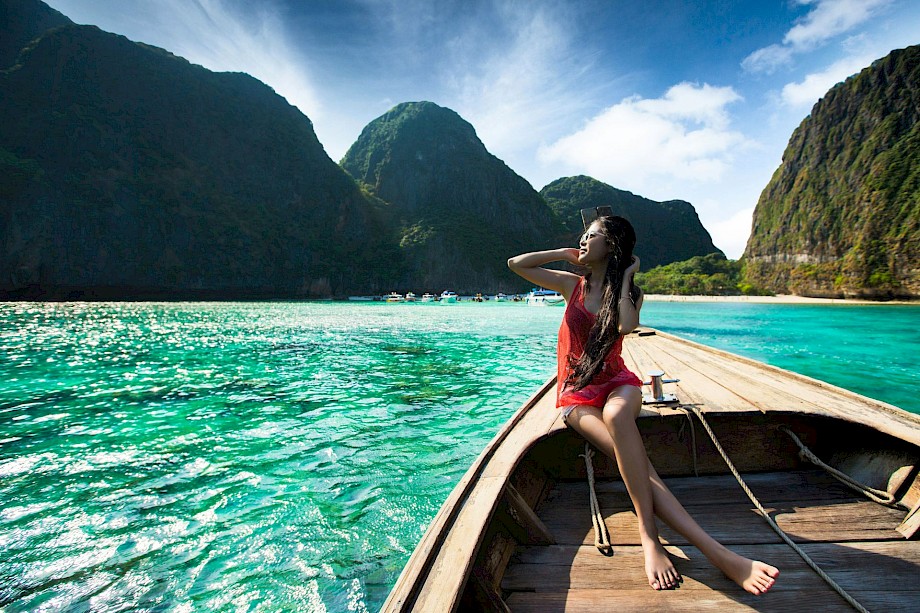 Relaxing on a boat in Asia. Unsplash@Getty Images
