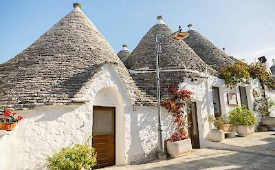 Houses on a hill in Alberobello, Puglia, Italy. Unsplash@Taisha Ellison