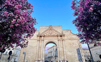 The Porta Napoli arch at the entrance to the historic center in Lecce. cc@Heather