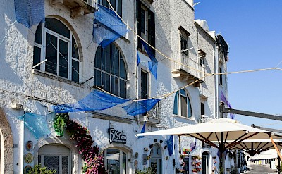 Seaside cafés and whitewashed buildings in Monopoli. Pexels@AXPphotograghy