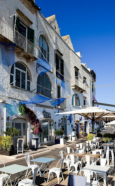 Seaside cafés and whitewashed buildings in Monopoli. Pexels@AXPphotograghy