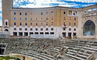 The Roman amphitheater in Lecce set against Baroque architecture &copy;Heather