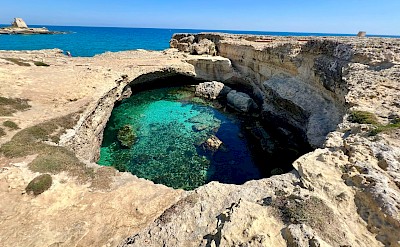 A natural sea pool carved into limestone cliffs along the Salento coast &copy;Heather