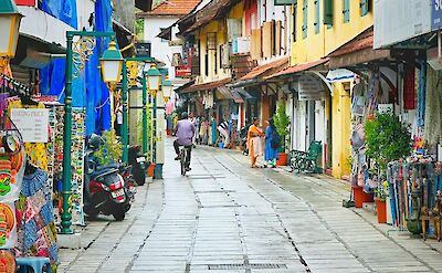 Pedestrian street with shops and caf&eacute;s in coastal South India. pexels@TomAntony