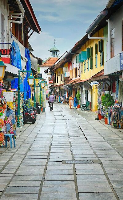 Pedestrian street with shops and caf&eacute;s in coastal South India. pexels@TomAntony