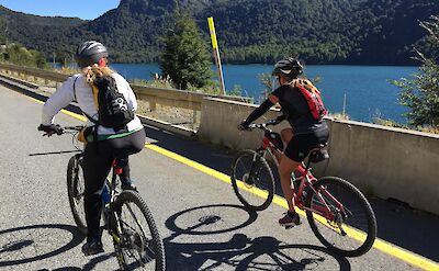 Riding paved roads along the lakes on Argentina to Chile bike tour. toAT