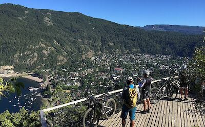 Pausing above town for a view on Argentina to Chile bike tour. toAT