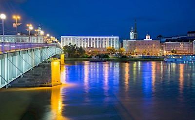 Colorful lights reflecting in the water in Linz, Austria. Unsplash@Alain Bonnardeaux