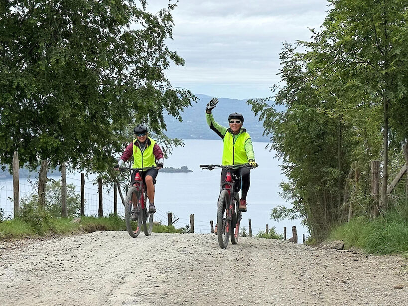 Hennie waving to the camera on the Patagonia bike tour.