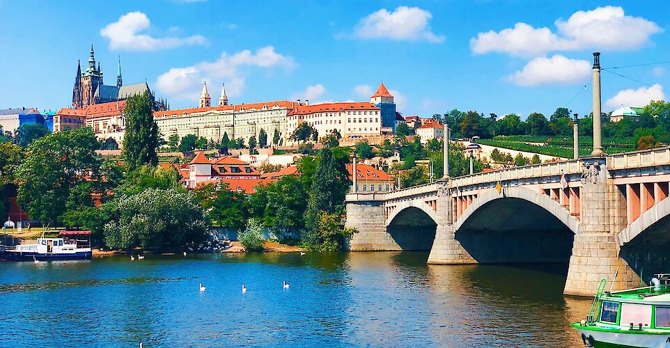 The Vltava River in Prague, with Prague Castle rising above. unsplash@lea