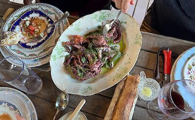 Regional cuisine shared around the table.