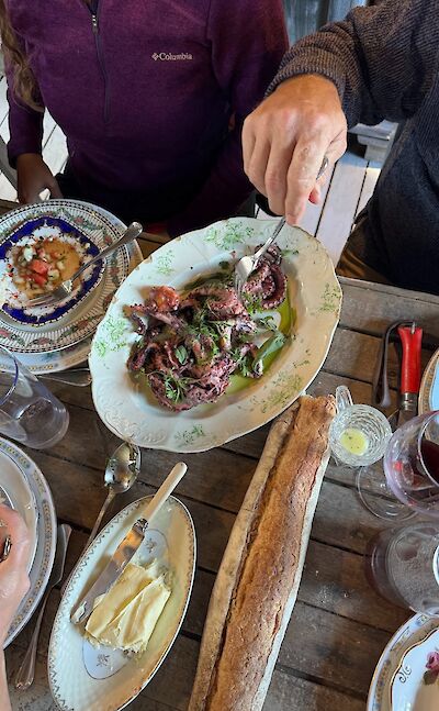 Regional cuisine shared around the table.