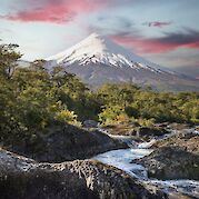 Flavors of Chile by E-Bike - Osorno Volcano rising above the Petrohué River. unsplash@vladimir fedotov
