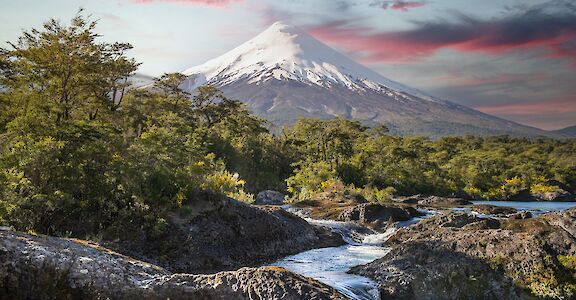 Osorno Volcano rising above the Petrohu&eacute; River. unsplash@vladimir fedotov