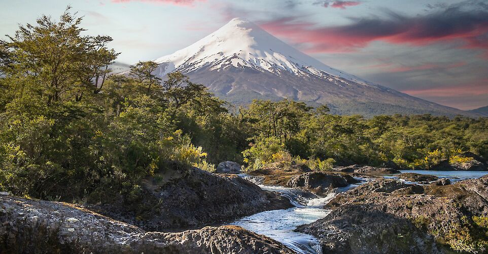 Osorno Volcano rising above the Petrohu&eacute; River. unsplash@vladimir fedotov