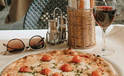 Traditional pizza enjoyed by the lake